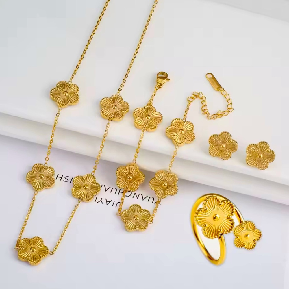 Set of yellow four leaves necklace, bracelets, earrings.
